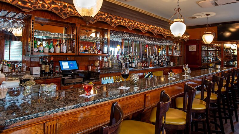Front bar area with four cocktails on bar top