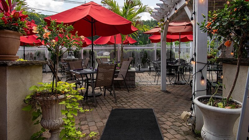 Outside patio with seating with umbrellas